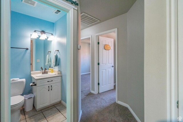 1301 W Indian Hills Dr Unit 59, St George, UT 84770 - bathroom with visible vents, toilet, and vanity