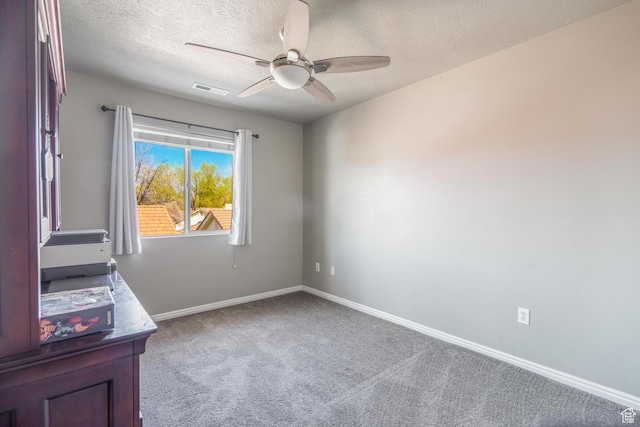 1301 W Indian Hills Dr Unit 59, St George, UT 84770 - unfurnished office with carpet, baseboards, a textured ceiling, visible vents, and ceiling fan