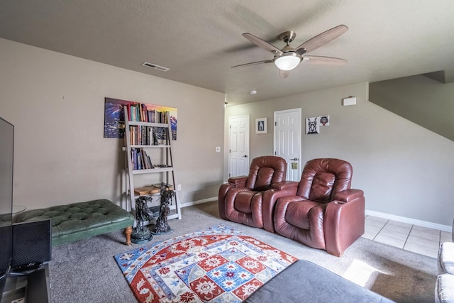 1301 W Indian Hills Dr Unit 59, St George, UT 84770 - tiled home theater with carpet flooring, a textured ceiling, visible vents, baseboards, and a ceiling fan