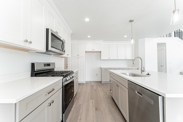 3877 W 950 N Unit 367, Lehi, UT 84043 - kitchen with appliances with stainless steel finishes, light wood-type flooring, light countertops, recessed lighting, and decorative light fixtures