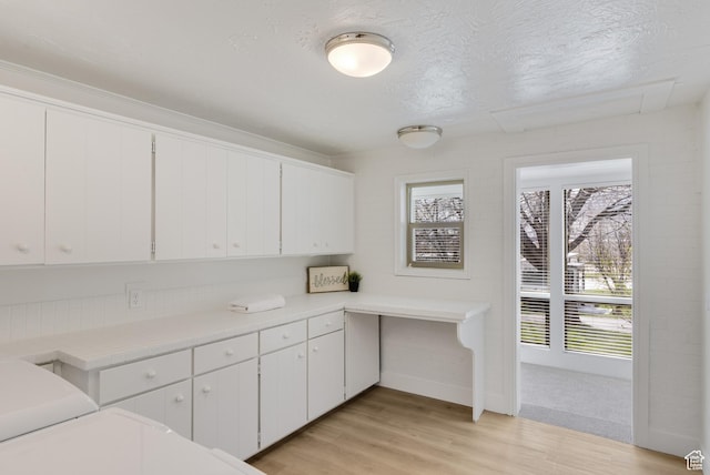199 N 300 W, Garden City, UT 84028 - kitchen with white cabinets, light countertops, and light wood-type flooring