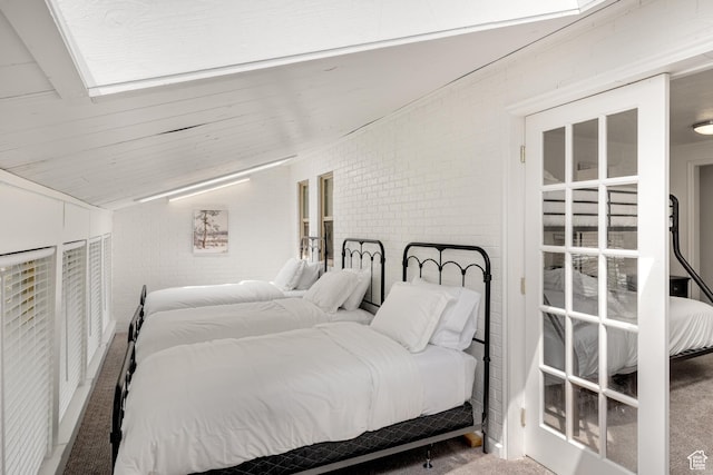 199 N 300 W, Garden City, UT 84028 - carpeted bedroom with lofted ceiling and brick wall
