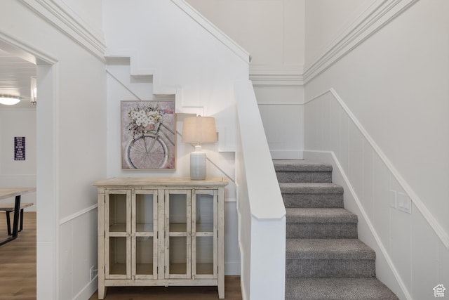 199 N 300 W, Garden City, UT 84028 - stairway featuring wainscoting, wood finished floors, and a decorative wall