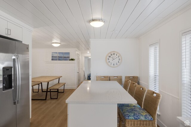 199 N 300 W, Garden City, UT 84028 - dining area with ornamental molding, light wood-style flooring, and wooden ceiling