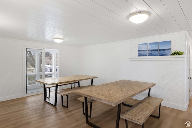 199 N 300 W, Garden City, UT 84028 - dining room with crown molding, wood finished floors, wood ceiling, and brick wall