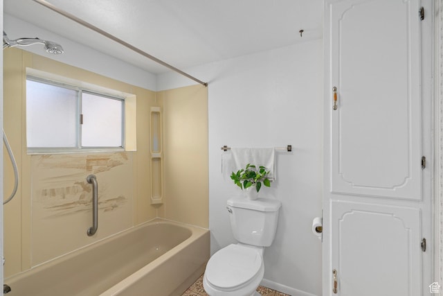 full bath with baseboards, toilet, and shower / bathtub combination