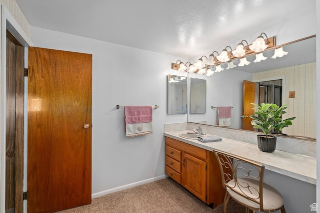bathroom with baseboards and vanity