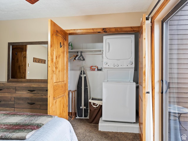 3615 N Wolf Lodge Dr E Unit 109, Eden, UT 84310 - laundry room featuring carpet flooring, stacked washer and dryer, laundry area, and a textured ceiling