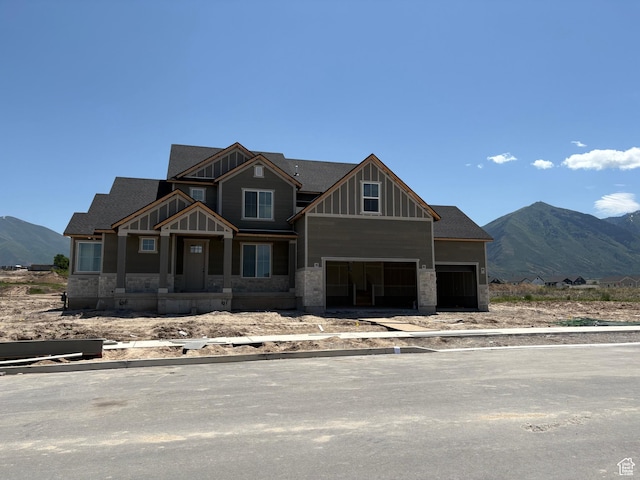 1242 N 290 E Unit 67, Salem, UT 84653 - view of front of home with board and batten siding, a mountain view, a garage, and stone siding