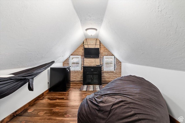278 S 100 E, Manti, UT 84642 - bedroom featuring refrigerator, vaulted ceiling, baseboards, a textured ceiling, and wood finished floors