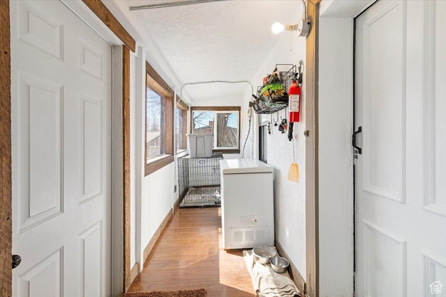278 S 100 E, Manti, UT 84642 - corridor featuring baseboards, a textured ceiling, and light wood-style flooring