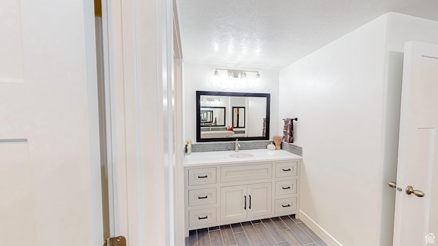452 S 2500 E Unit 122, Spanish Fork, UT 84660 - bathroom featuring a textured ceiling, wood tiled floor, and vanity