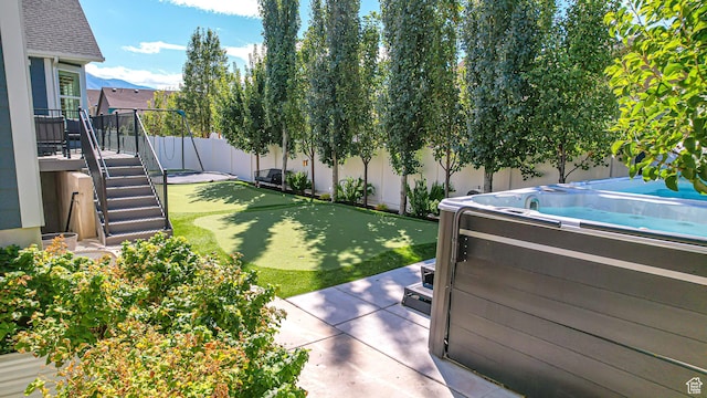 452 S 2500 E Unit 122, Spanish Fork, UT 84660 - view of yard featuring a hot tub and a fenced backyard
