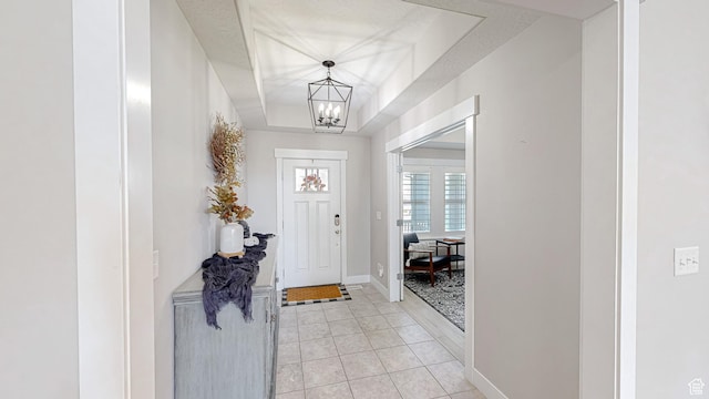 452 S 2500 E Unit 122, Spanish Fork, UT 84660 - foyer featuring an inviting chandelier, a raised ceiling, light tile patterned floors, and baseboards