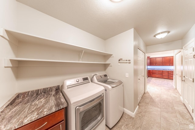 907 W 1840 S Unit B, Syracuse, UT 84075 - laundry room featuring independent washer and dryer, cabinet space, baseboards, and a textured ceiling