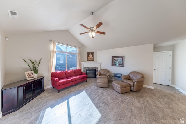 907 W 1840 S Unit B, Syracuse, UT 84075 - living room featuring vaulted ceiling, a stone fireplace, baseboards, visible vents, and ceiling fan