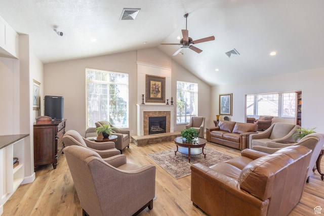 907 W 1840 S Unit B, Syracuse, UT 84075 - living room featuring a ceiling fan, a tile fireplace, a healthy amount of sunlight, and visible vents