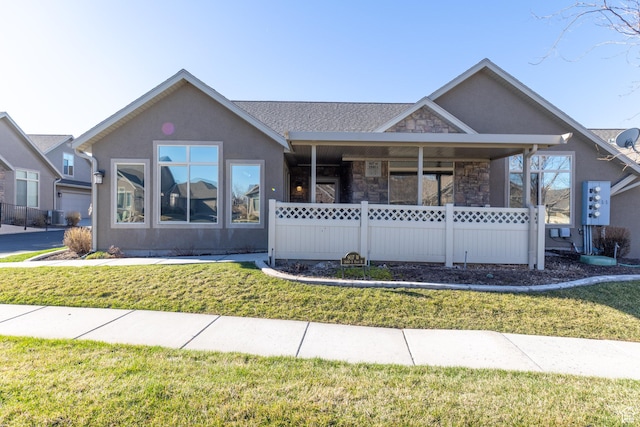 907 W 1840 S Unit B, Syracuse, UT 84075 - view of front of property with stone siding, a front yard, stucco siding, and cooling unit