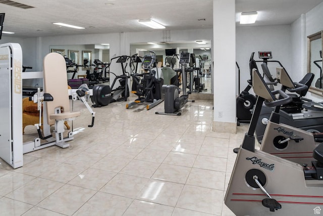 gym with visible vents and tile patterned floors
