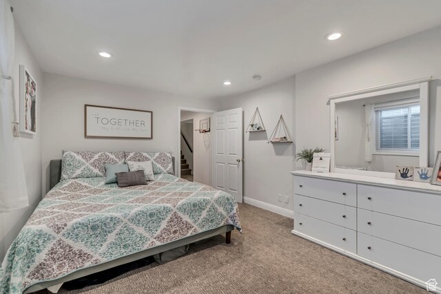 carpeted bedroom with baseboards and recessed lighting