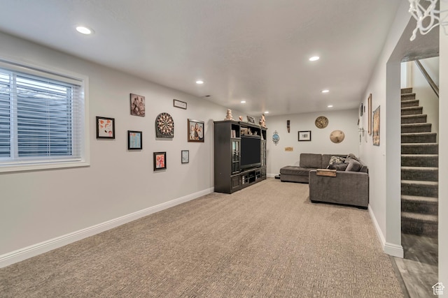 living room with baseboards, stairs, and recessed lighting