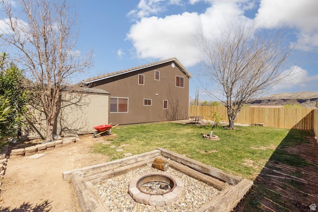 172 W 500 N, Hurricane, UT 84737 - view of yard with a fenced backyard and an outdoor fire pit