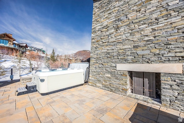 2908 W Deer Pointe Dr, Heber City, UT 84032 - view of patio / terrace with a hot tub and an outdoor fireplace