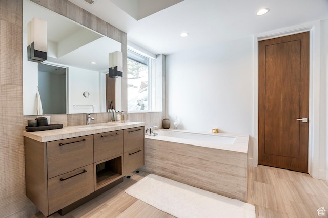2908 W Deer Pointe Dr, Heber City, UT 84032 - bathroom with vanity, a garden tub, and recessed lighting