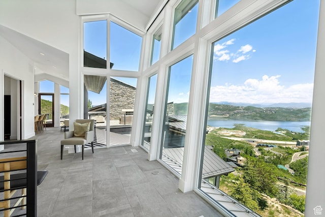 2908 W Deer Pointe Dr, Heber City, UT 84032 - sunroom / solarium featuring a water view and a towering ceiling