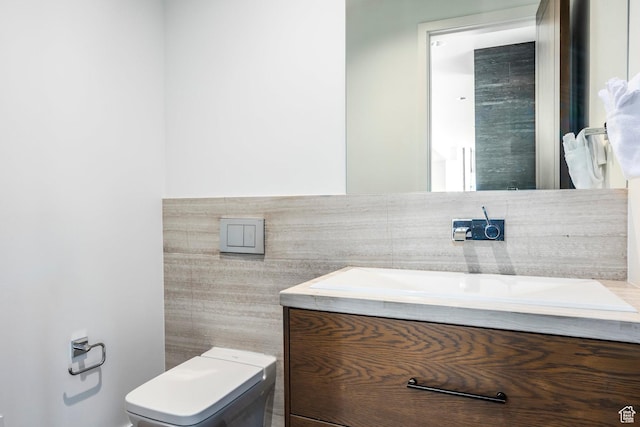 2908 W Deer Pointe Dr, Heber City, UT 84032 - bathroom with toilet, vanity, a wainscoted wall, and tile walls