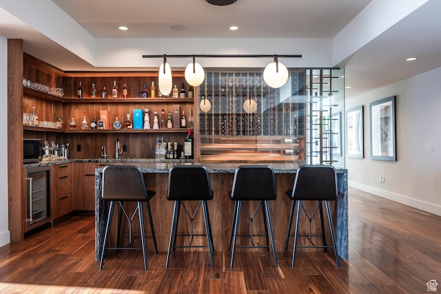 2908 W Deer Pointe Dr, Heber City, UT 84032 - indoor wet bar with beverage cooler, dark wood-type flooring, and recessed lighting