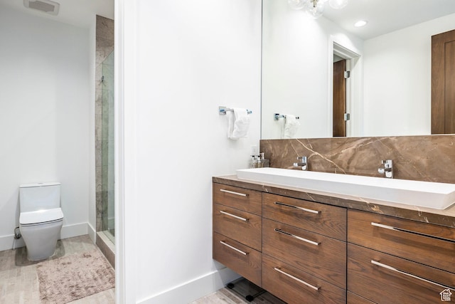 2908 W Deer Pointe Dr, Heber City, UT 84032 - full bathroom featuring a stall shower, toilet, vanity, baseboards, and decorative backsplash