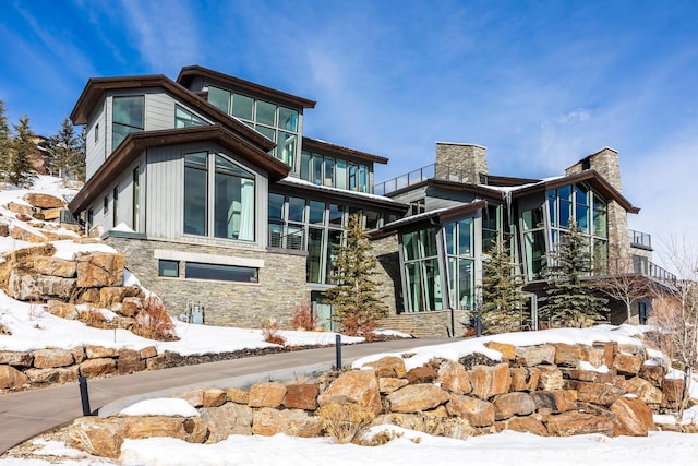 2908 W Deer Pointe Dr, Heber City, UT 84032 - exterior space with stone siding and a chimney