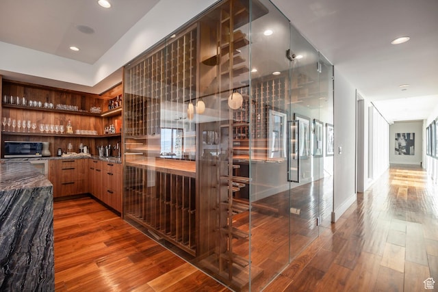 2908 W Deer Pointe Dr, Heber City, UT 84032 - bar with black microwave, wood finished floors, and recessed lighting