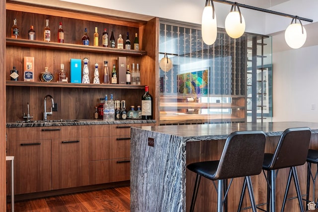 2908 W Deer Pointe Dr, Heber City, UT 84032 - bar with hanging light fixtures, dark wood-style floors, wet bar, and a sink
