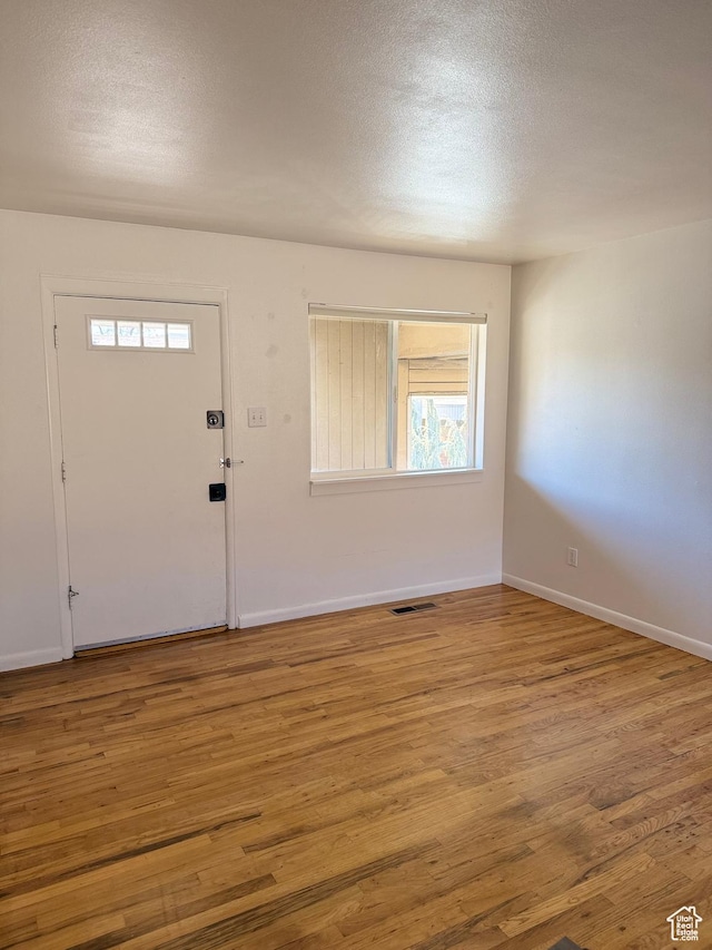650 N 300 W Unit 234, Salt Lake City, UT 84103 - entryway with visible vents, wood finished floors, and a textured ceiling