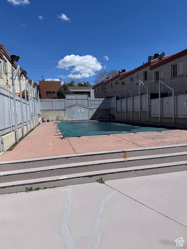 650 N 300 W Unit 234, Salt Lake City, UT 84103 - view of swimming pool with a residential view and fence