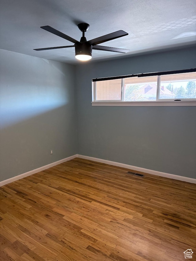 650 N 300 W Unit 234, Salt Lake City, UT 84103 - empty room with a ceiling fan, wood finished floors, baseboards, and visible vents