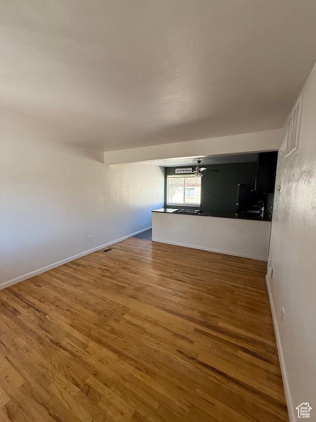 650 N 300 W Unit 234, Salt Lake City, UT 84103 - empty room featuring baseboards, ceiling fan, and wood finished floors