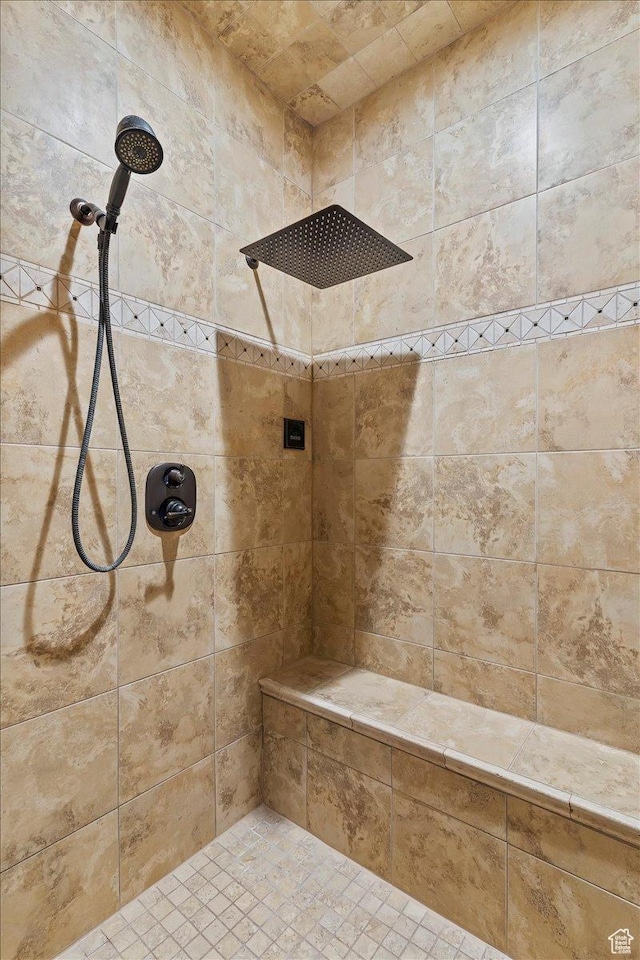 bathroom featuring a tile shower