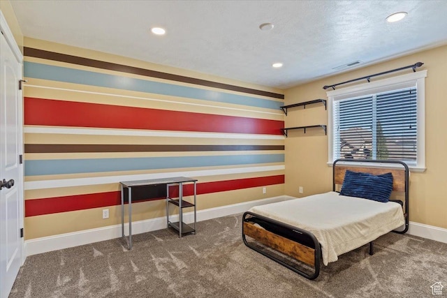 carpeted bedroom with baseboards, visible vents, recessed lighting, and a textured ceiling