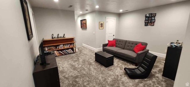 carpeted living area with baseboards, visible vents, and recessed lighting