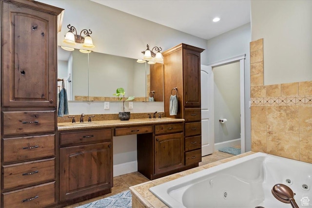 full bathroom with a tub with jets, double vanity, a sink, and tile patterned flooring