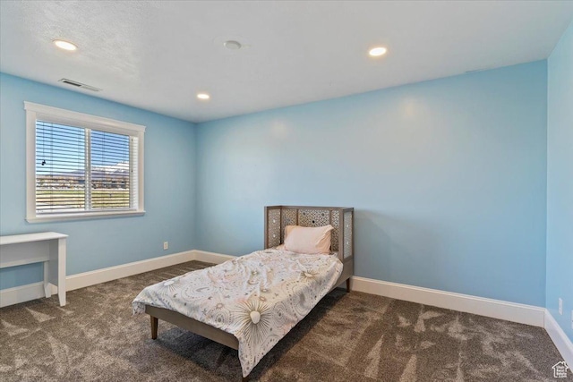 carpeted bedroom featuring recessed lighting, baseboards, and visible vents