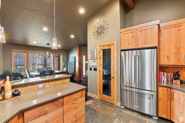 3594 E 3800 S, Salt Lake City, UT 84109 - kitchen with freestanding refrigerator, stone finish flooring, recessed lighting, hanging light fixtures, and light brown cabinets