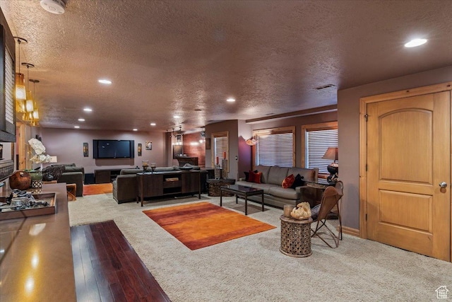 3594 E 3800 S, Salt Lake City, UT 84109 - carpeted living room featuring recessed lighting, hardwood / wood-style flooring, and a textured ceiling