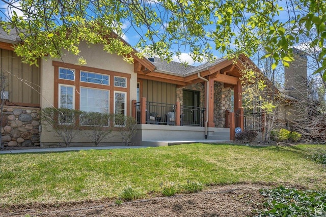 3594 E 3800 S, Salt Lake City, UT 84109 - back of property featuring a yard, stone siding, and board and batten siding