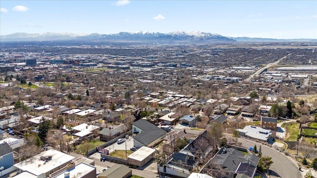 drone / aerial view featuring a residential view and a mountain view
