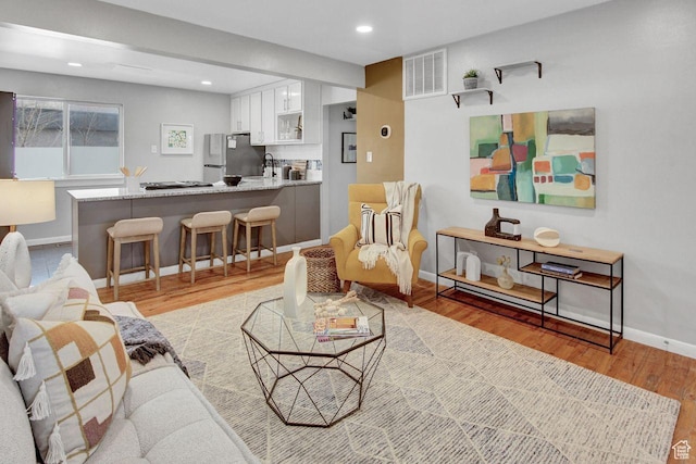 650 N 300 W Unit 202, Salt Lake City, UT 84103 - living room with recessed lighting, baseboards, light wood finished floors, and visible vents