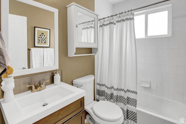 650 N 300 W Unit 202, Salt Lake City, UT 84103 - full bathroom featuring decorative backsplash, toilet, and vanity